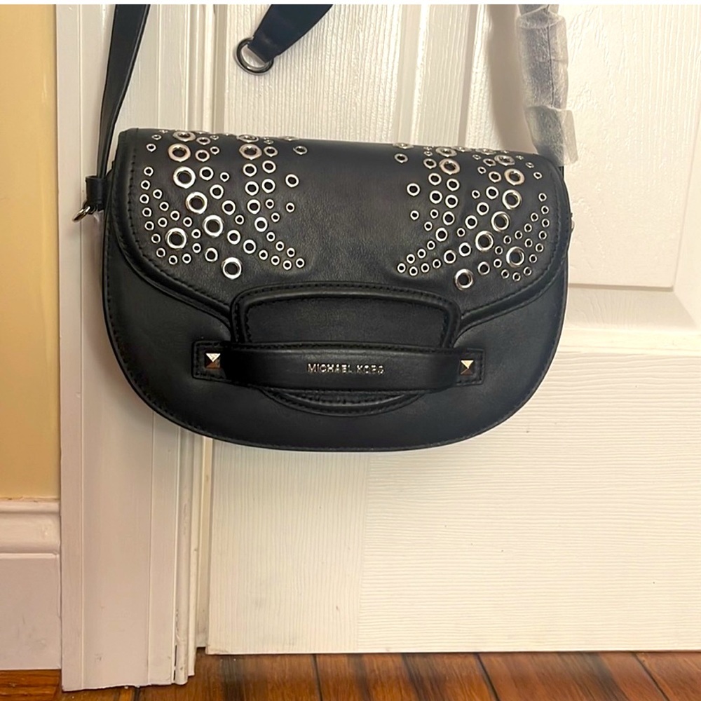 Brand new never used Michael Kors purse with silver color metal detail